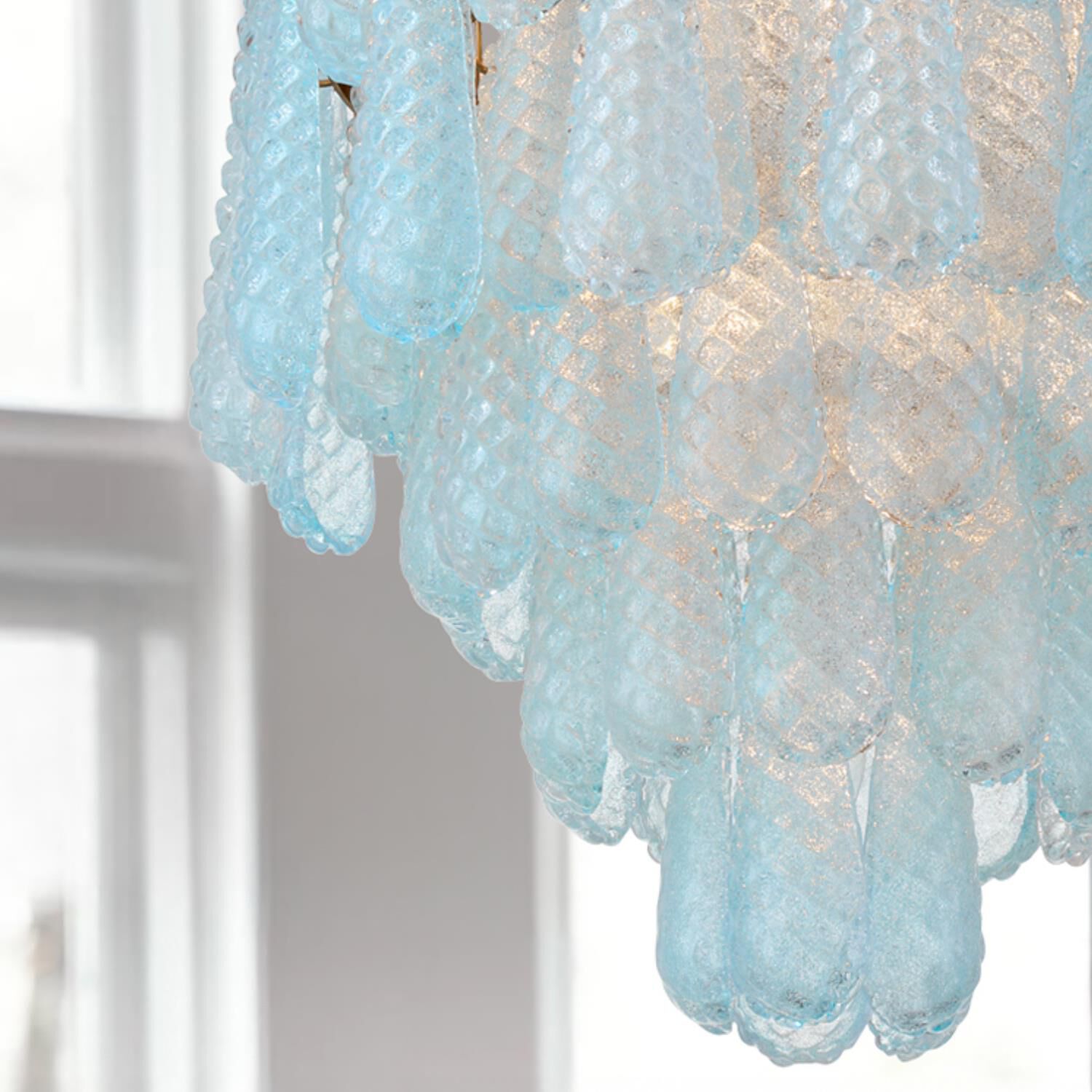 Shown in Aged Brass finish and Sand Blue glass